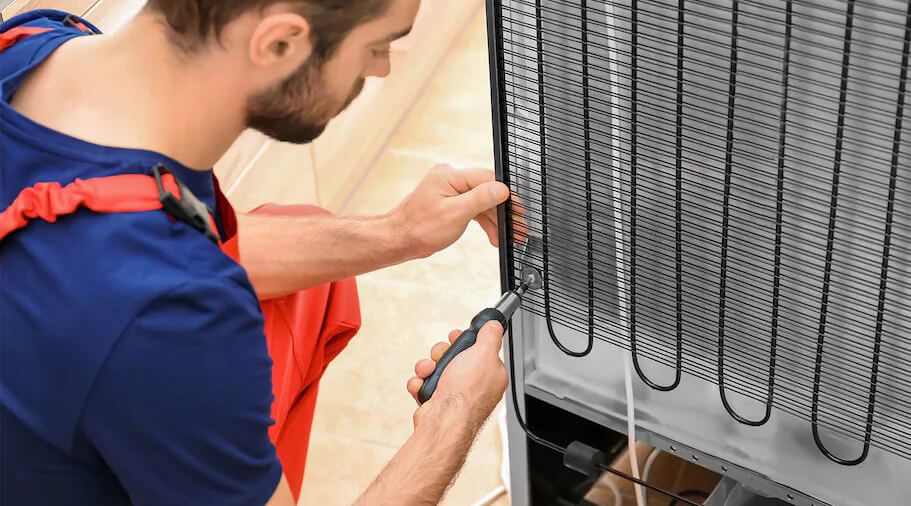 Cleaning fridge coils to save electricity